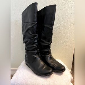 Waterproof black knee high boots